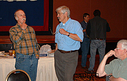 Ben Grussendorf left considers a question during a break at an Alaska Board of Game meeting