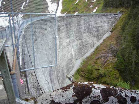 Salmon Creek Dam near Juneau  Built in 19151917  In many parts of Alaska that there are opportunities for hydroelectric development that have a minimal effect on salmon  Many developments use watersheds above a salmon passage barrier to produce electricity Those projects take water from a lake or stream above the barrier and return it to the stream at a point where there will be little or no effect on salmon Photo MD Miller 652012