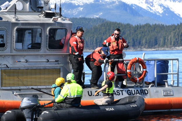 Aboard their vessel US Coast Guard Station Juneau crew members provide safety and communications support to the response team keeping the area secure and directing passing mariners during the response effort Credit Alaska Department of Fish and GameJamie Musbach NOAA Fisheries Permit 24359